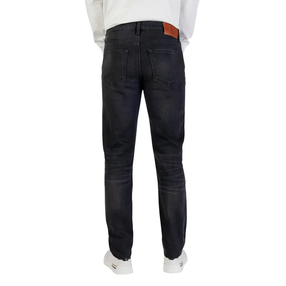 Jean skinny bleu en coton calvin klein avec coupe slim et patch marque en cuir marron sur la ceinture arrière