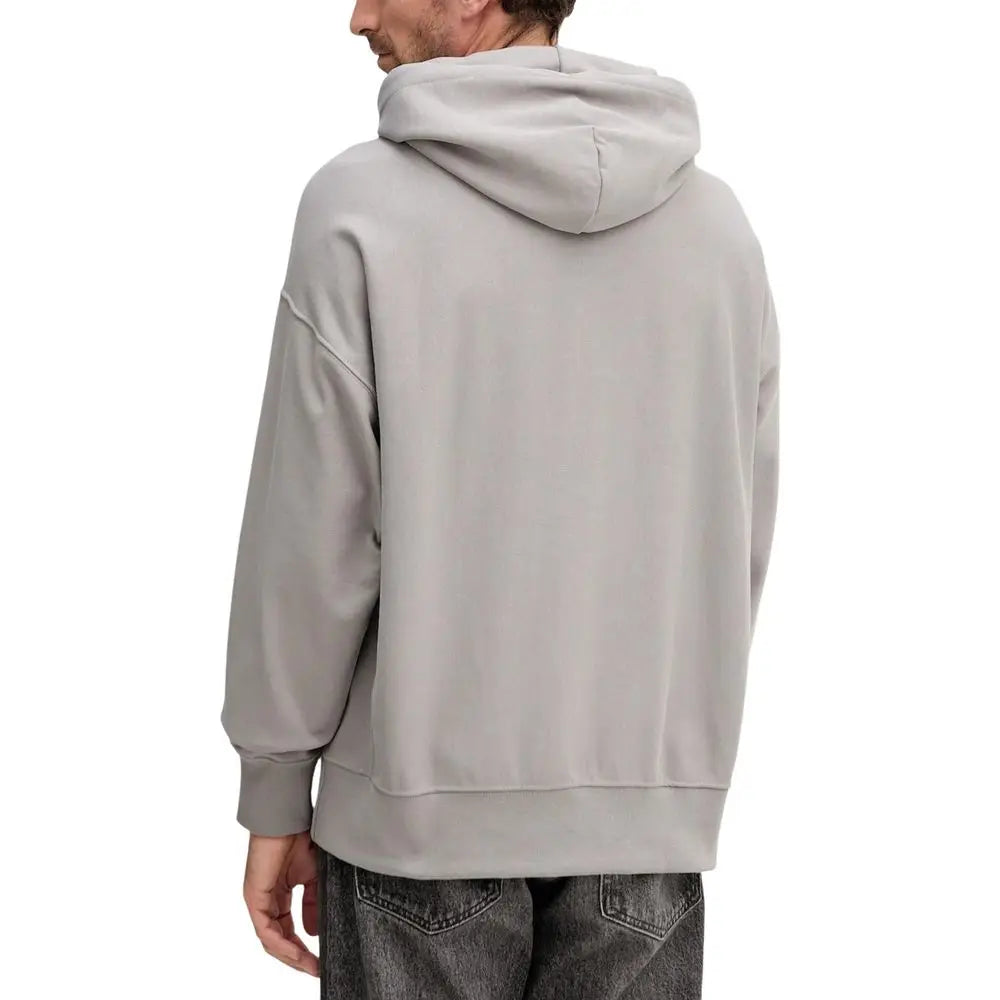 Un sweat à capuche calvin klein jeans gris clair en coton avec coupe décontractée et poignets côtelés