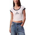 Débardeur blanc en coton de la marque Calvin Klein Jeans, ajusté et simple, porté sur un mannequin.