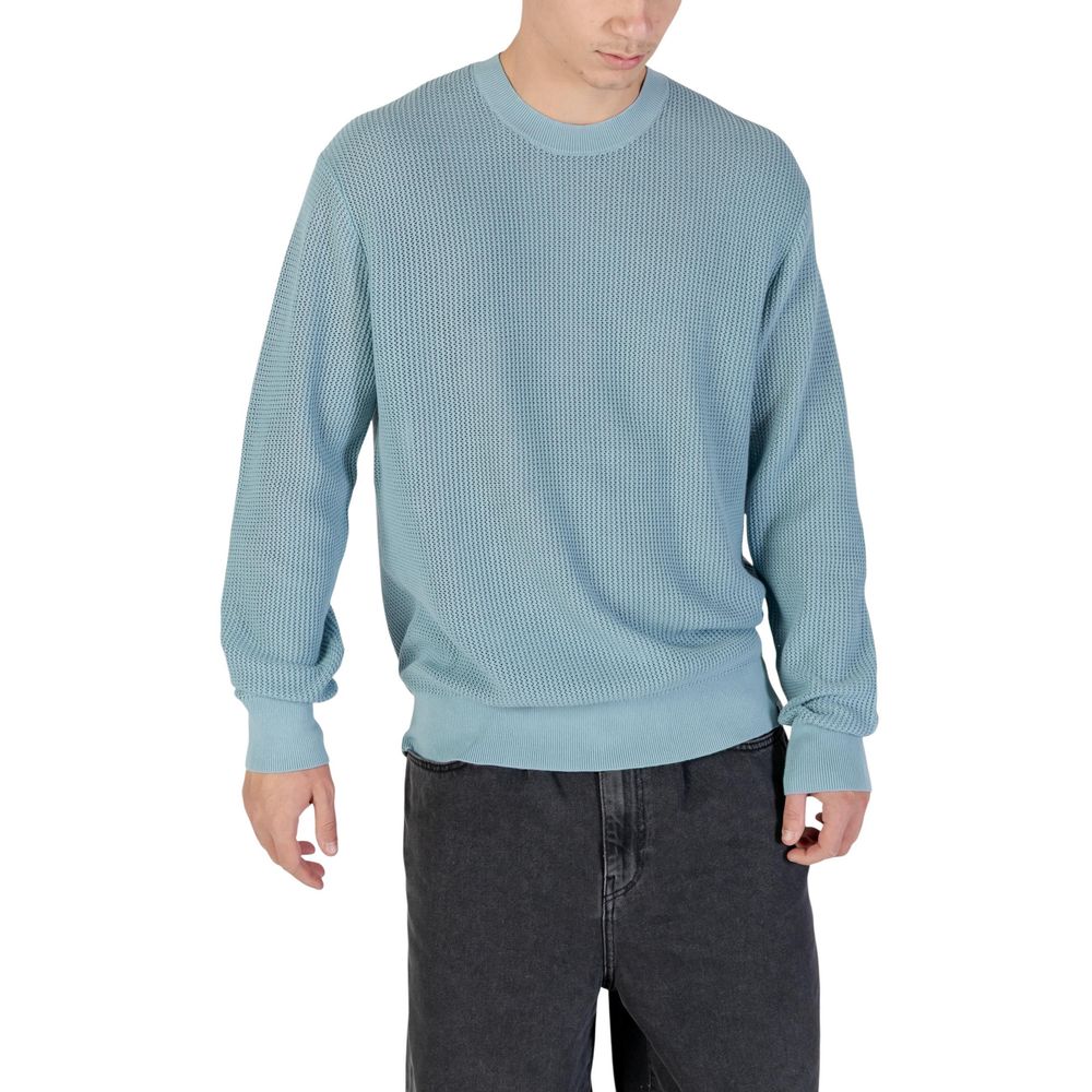 Sweatshirt en coton bleu de Calvin Klein Jeans, style décontracté, avec logo discret visible sur le devant.