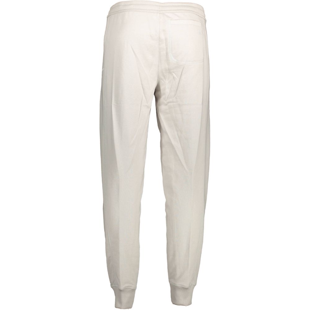 Pantalon de sweat en coton gris pour homme de la marque Calvin Klein, vue de face sur un fond neutre.