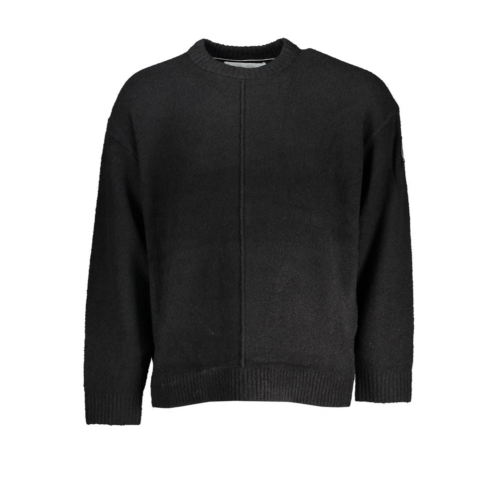 Pull homme Calvin Klein en coton noir, style simple et élégant, avec logo discret sur la poitrine.