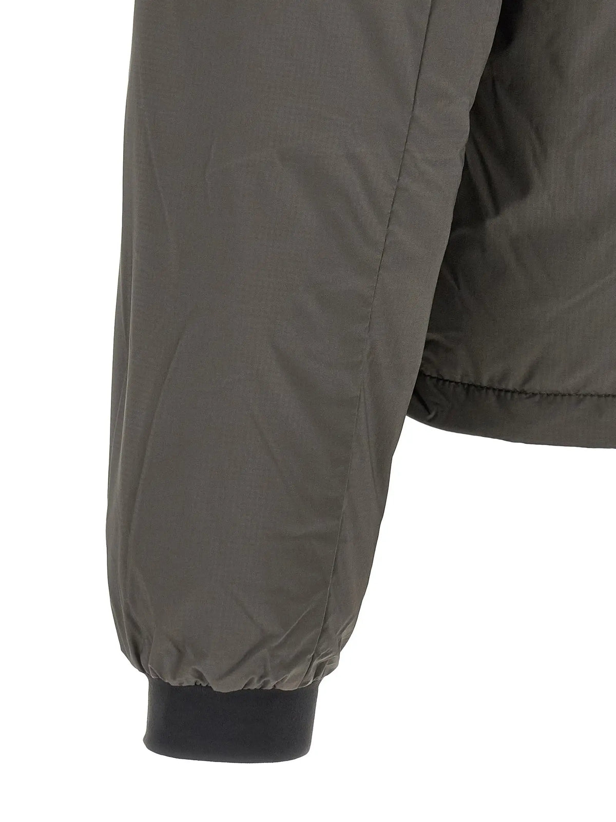 La manche olive verte du Canada Goose bicolor polyamide full-length jacket avec bord-côte noir et coutures discrètes