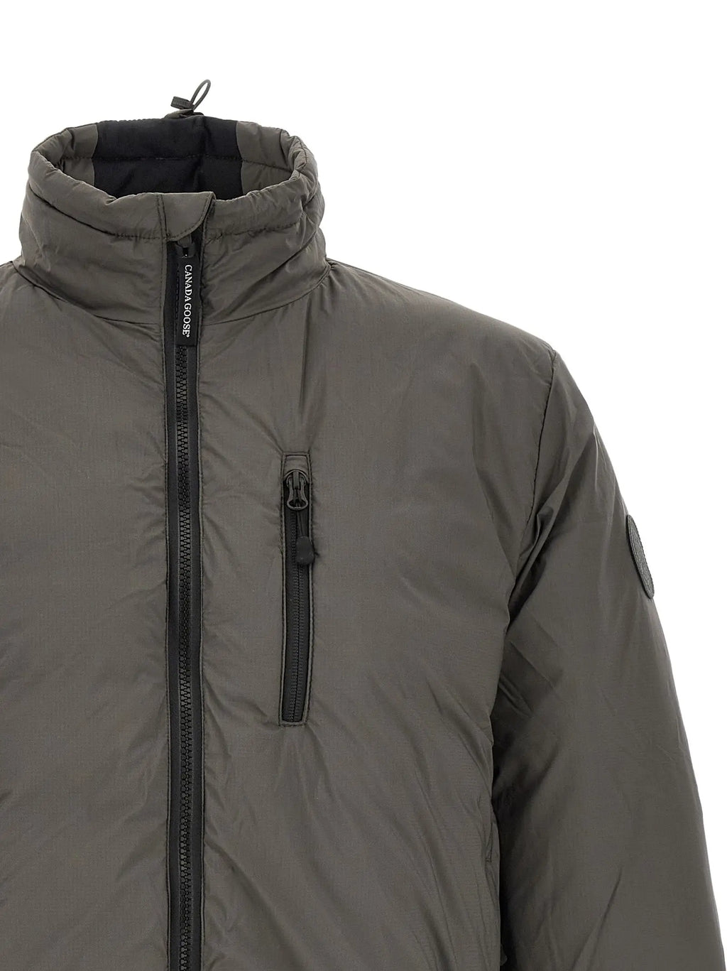 Veste longue canada goose bicolor en polyamide vert olive foncé avec fermetures éclair noires et étiquette brandée au col