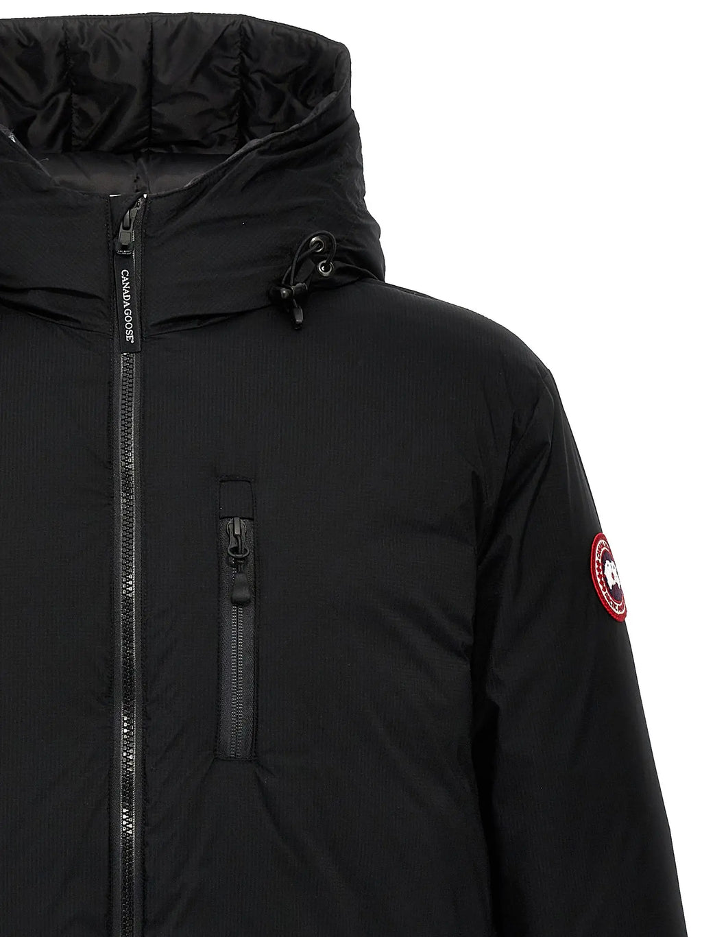 Veste canada goose noire en polyester avec texture matelassée et logo rouge circulaire sur la manche