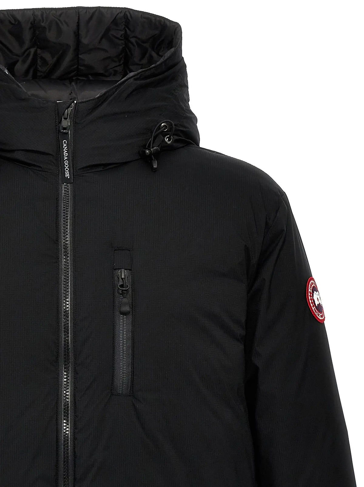 Veste canada goose noire en polyester avec texture matelassée et logo rouge circulaire sur la manche