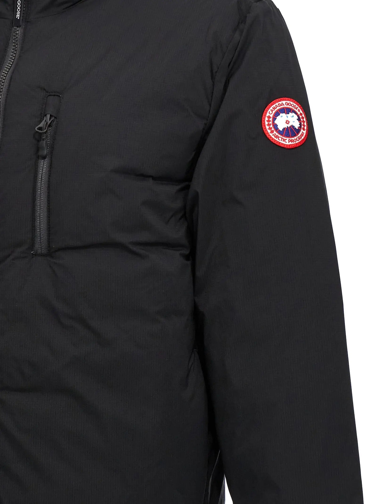 Veste canada goose noire en polyester avec patch logo rouge et blanc rond sur la manche