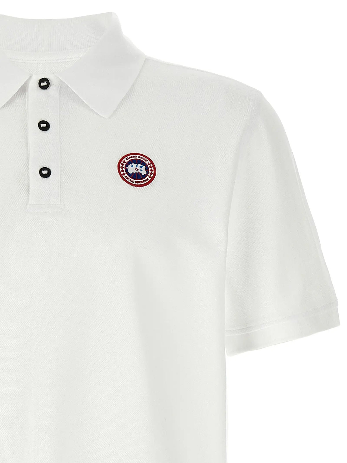 Polo blanc en coton canada goose avec boutons noirs et logo brodé circulaire sur la poitrine