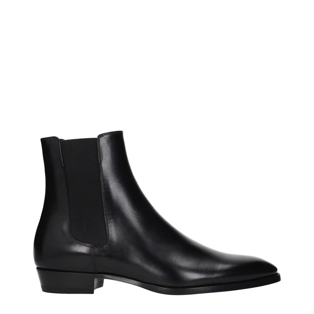 Bottines celine en cuir noir avec finition élégante et panneaux élastiques latéraux style chelsea