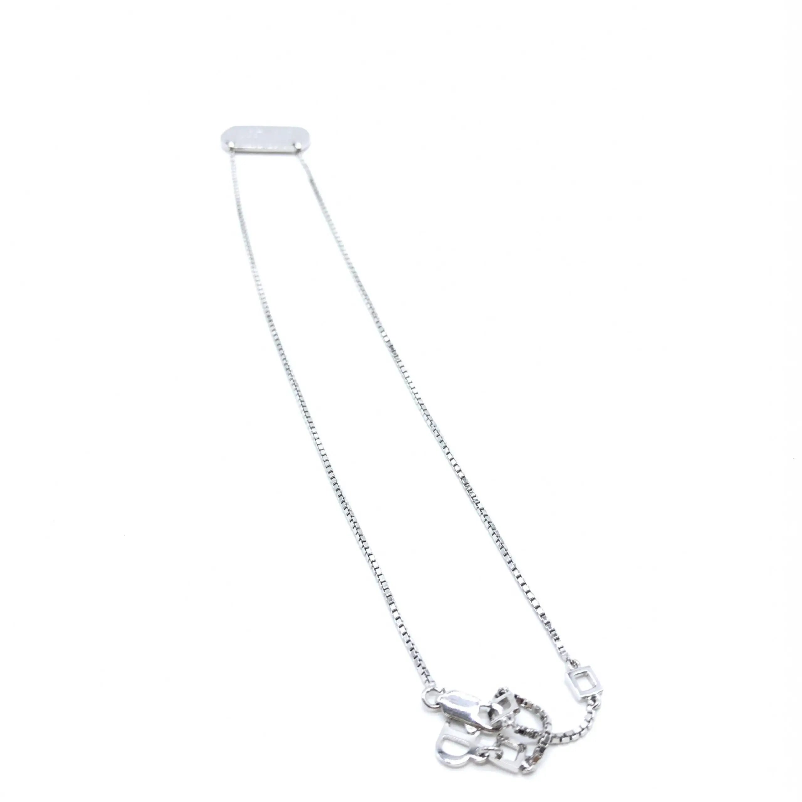 Collier christian dior en argent sterling 925 avec chaîne argentée et pendentifs clés entrelacées art déco