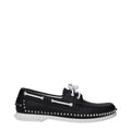Christian Louboutin slip on loafers en cuir noir avec clous argentés le long de la semelle et lacets blancs