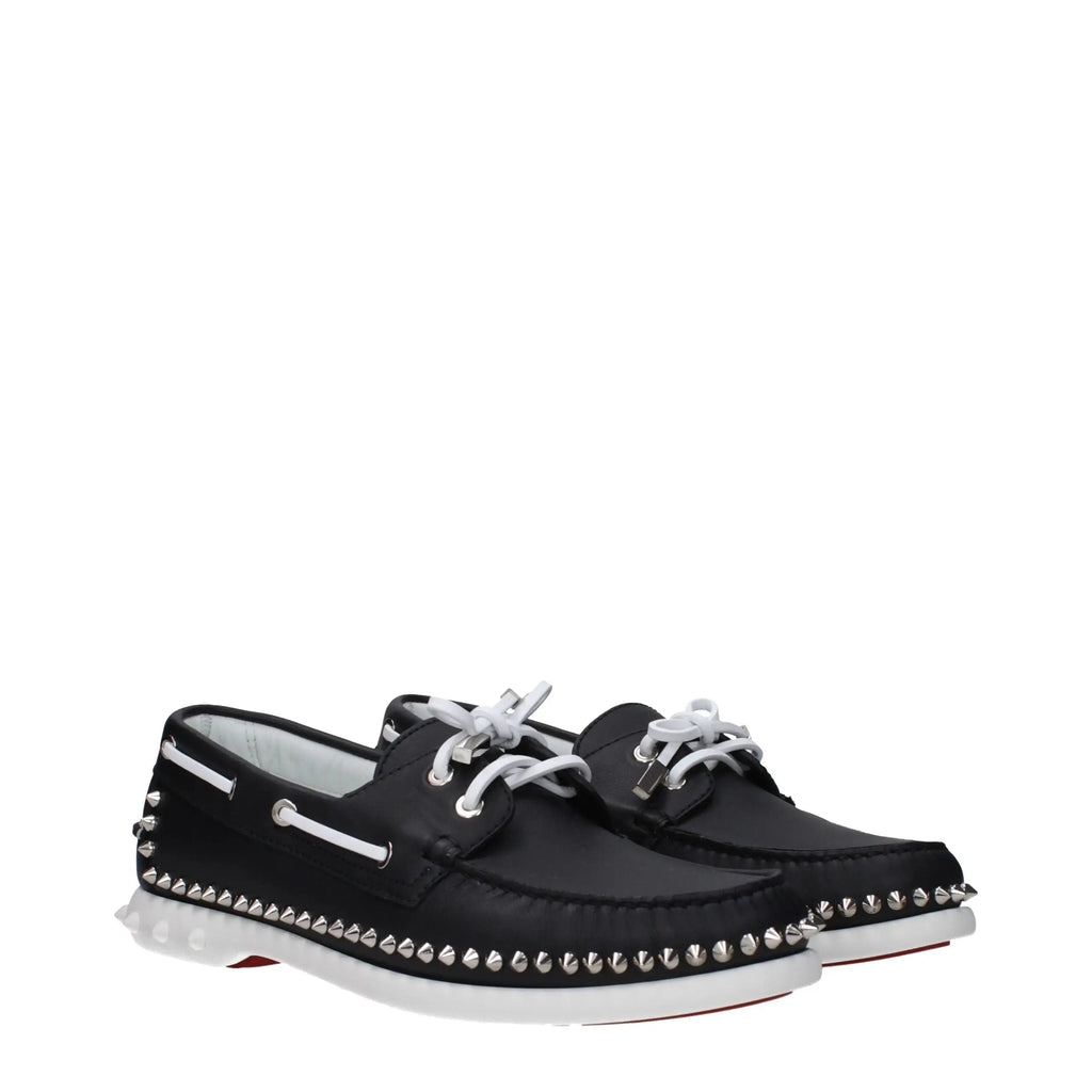 Christian louboutin black leather slip-on loafers with silver studs along edges and white laces
