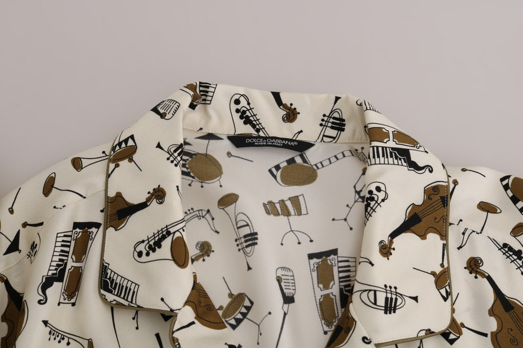 Chemise en soie blanche Dolce & Gabbana avec motif jazz, vue de face sur un fond neutre.