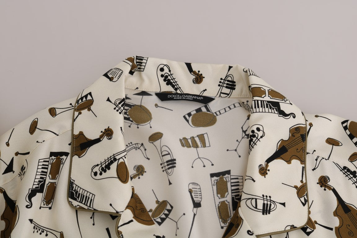 Chemise en soie blanche Dolce & Gabbana avec motif jazz, vue de face sur un fond neutre.