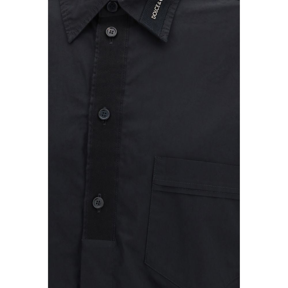 Chemise noire en coton de Dolce & Gabbana, vêtement élégant avec col classique et boutons visibles, pour hommes.