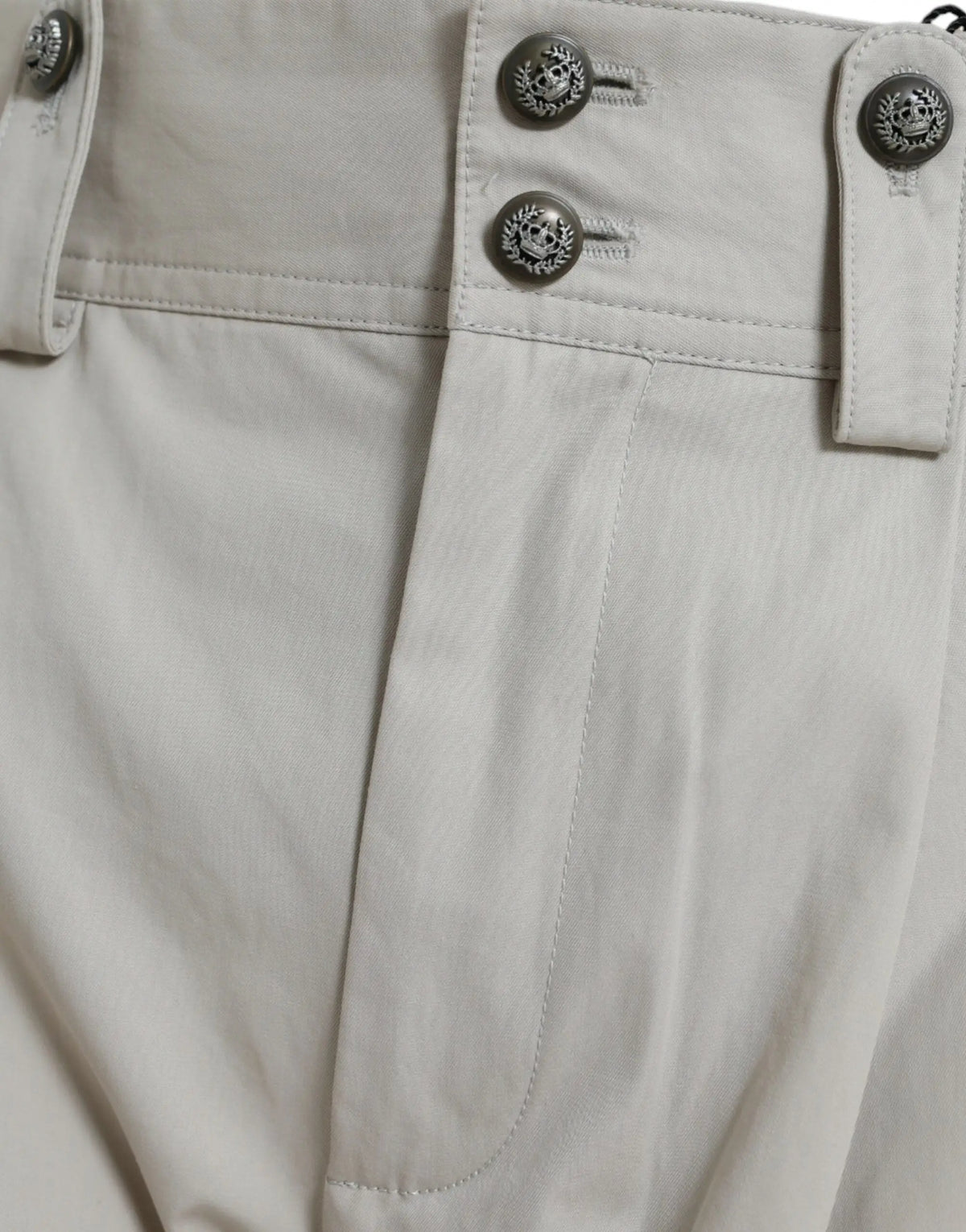 Pantalon beige en coton dolce & gabbana taille haute avec boutons argentés décoratifs en forme de feuilles de laurier