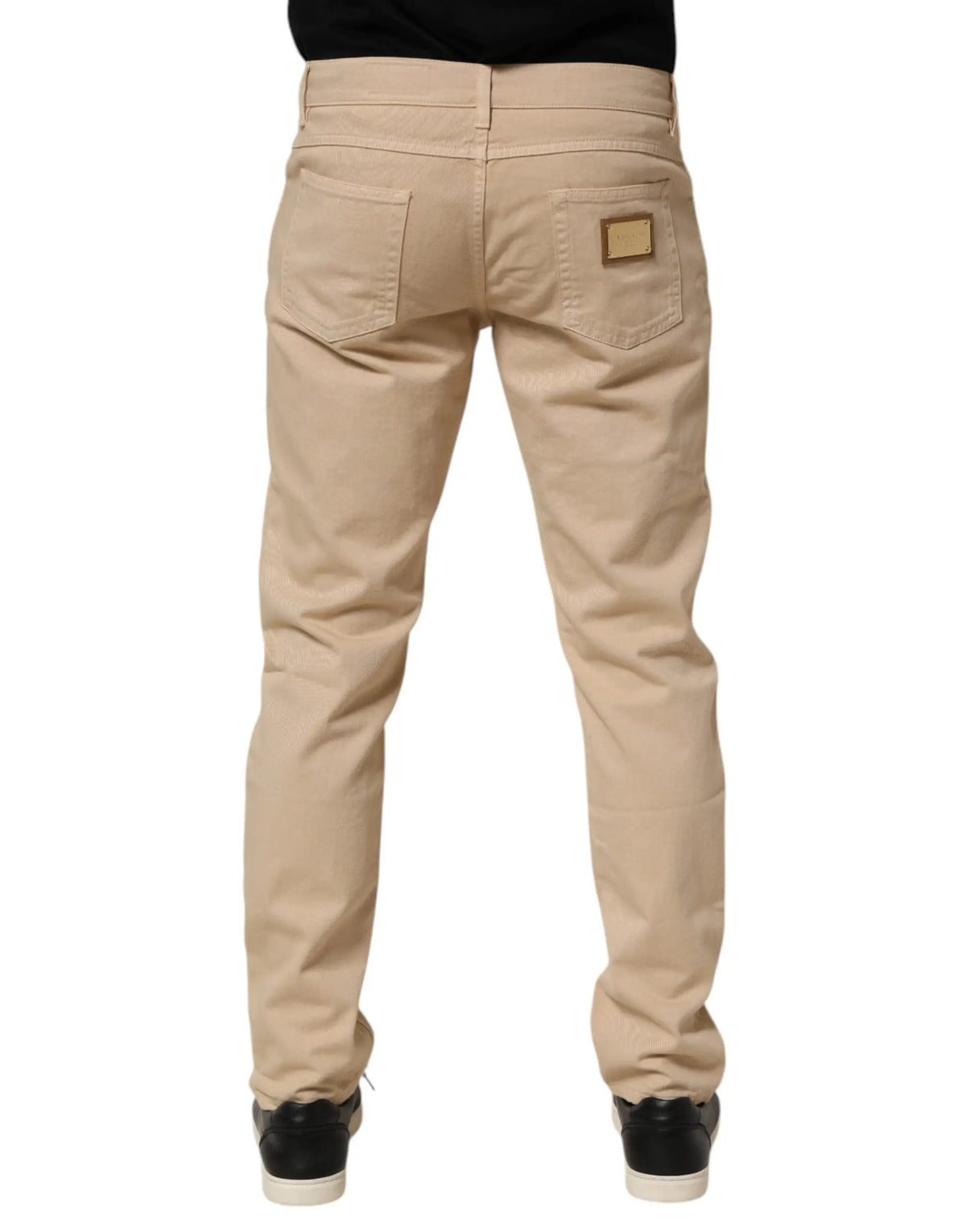 Vue arrière d un jean en coton beige dolce & gabbana skinny regular avec texture subtile et patch rectangulaire