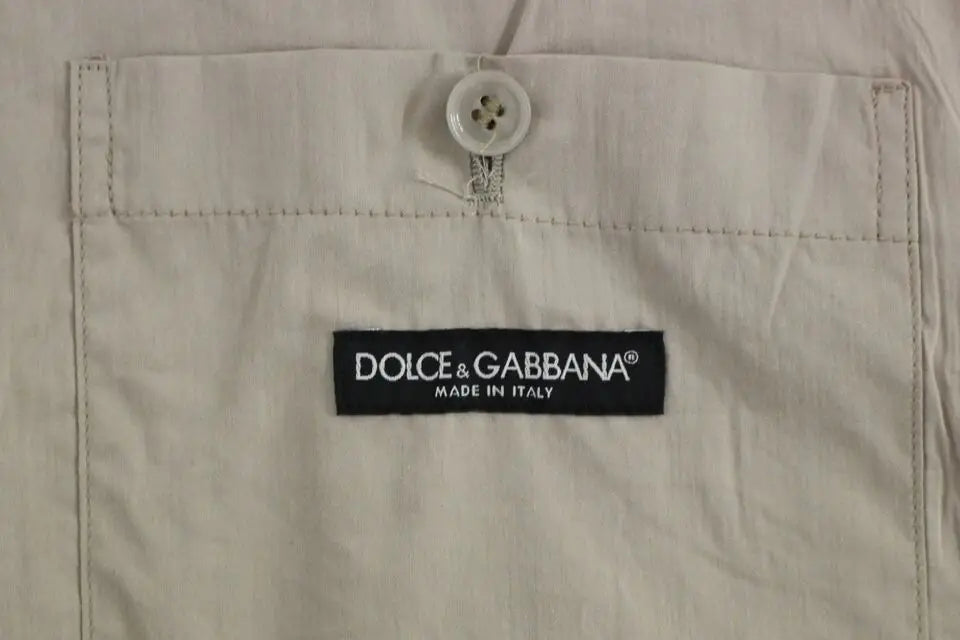 Poche d un gilet robe beige dolce & gabbana en coton slim fit avec bouton blanc et étiquette noire marque
