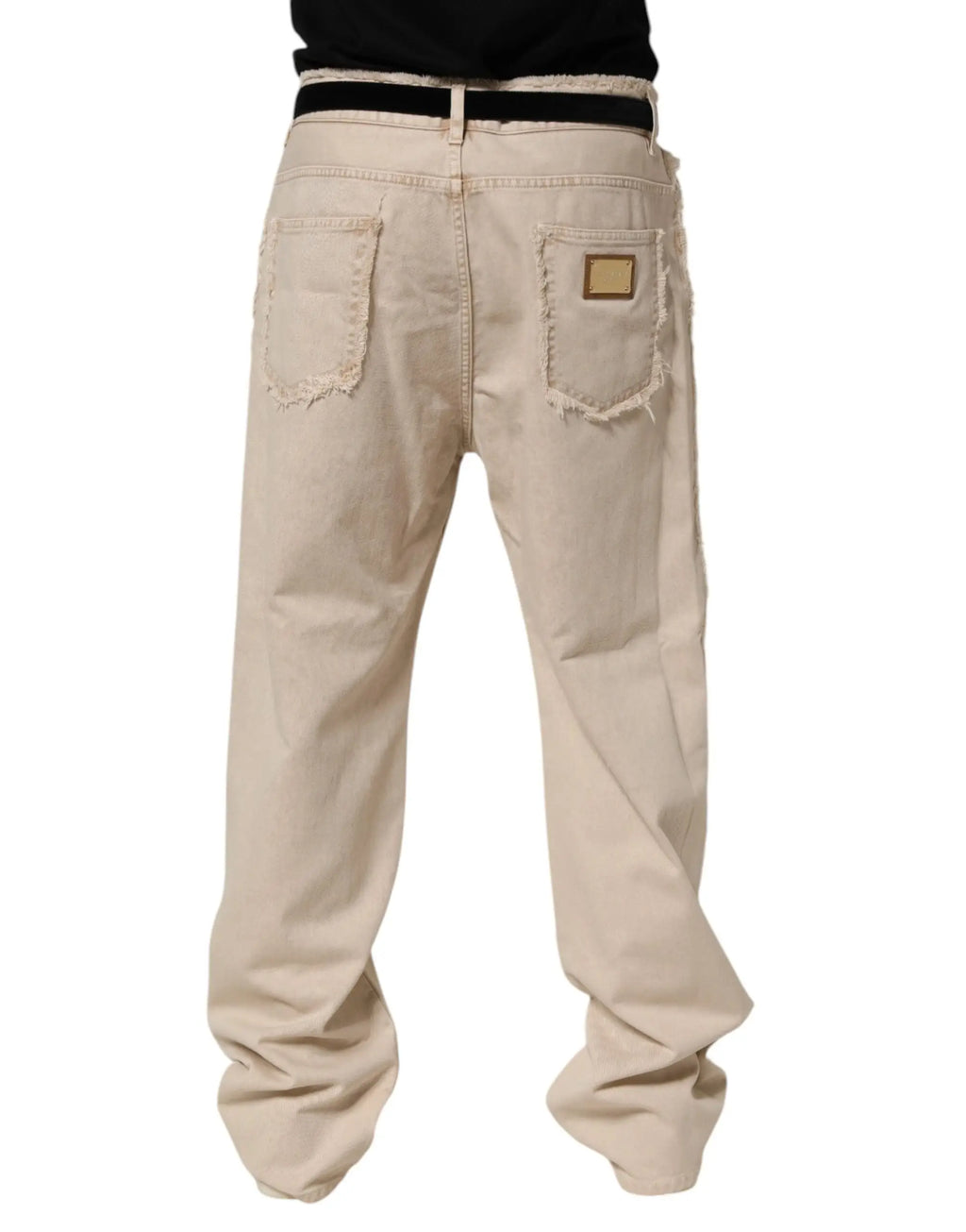 Jeans en denim beige distressed dolce gabbana en coton avec ourlets effilochés vu de dos et patch marque doré
