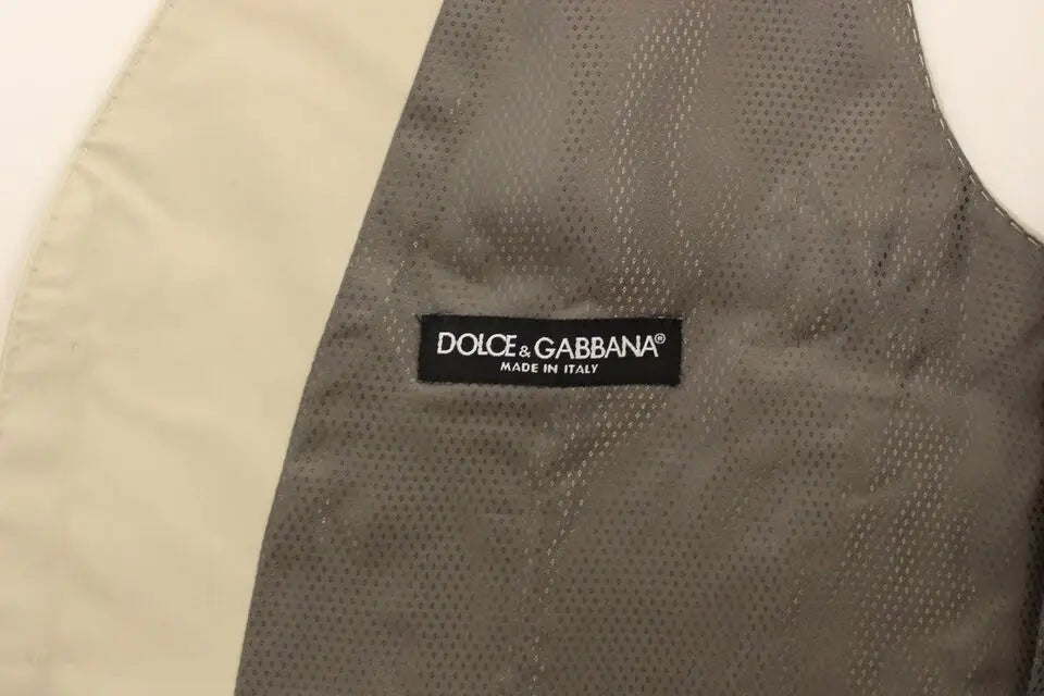 Intérieur de la veste beige en coton extensible dolce & gabbana avec tissu gris perforé et étiquette visible