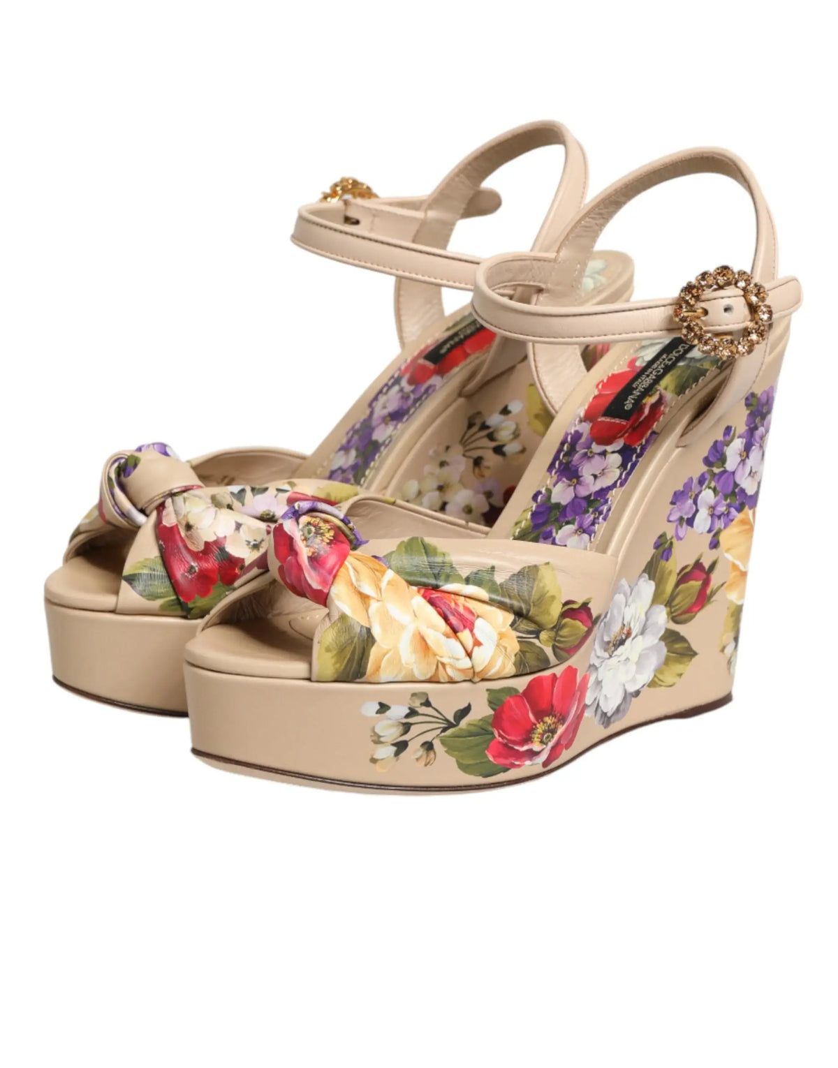 Beige floral ankle strap wedge sandals by Dolce & Gabbana with decorative bow and jeweled buckle accents