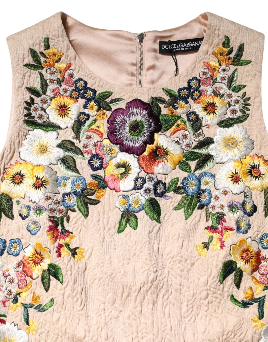 Top sans manches beige dolce gabbana avec broderie florale colorée et détails de feuilles vertes