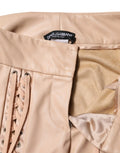 Pantalon skinny beige dolce gabbana en cuir effet corset avec laçage avant et œillets argentés raffinés