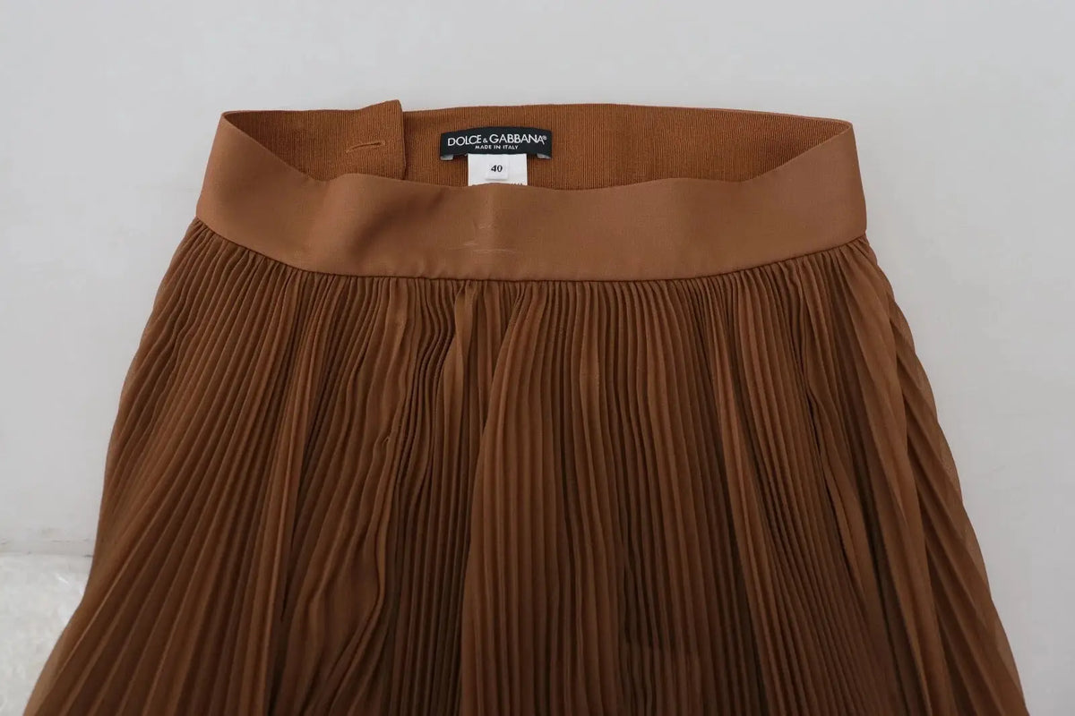 Jupe midi plissée beige dolce gabbana en chiffon avec ceinture assortie et étiquette de marque visible