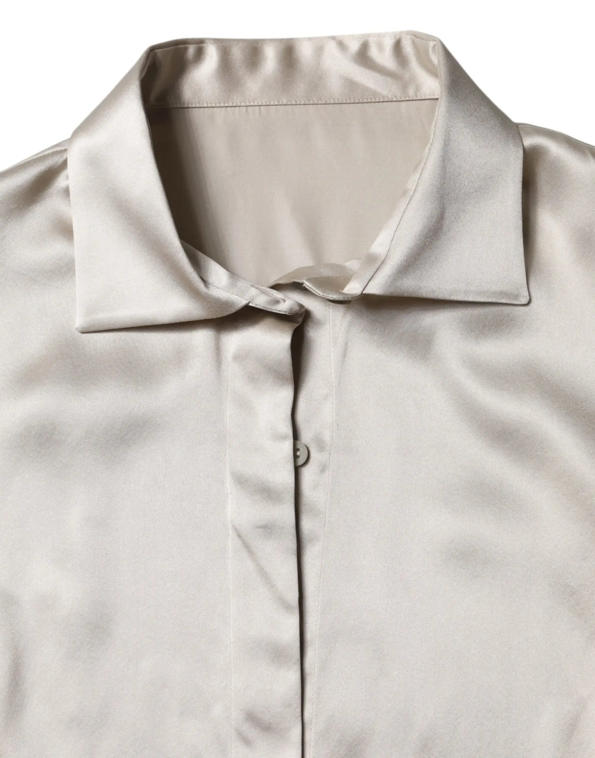 Un chemisier satiné beige dolce gabbana en soie avec colnet élégant et manches longues