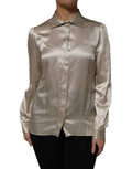 Blouse beige en soie satinée dolce gabbana à manches longues avec col classique et poignets plissés subtils