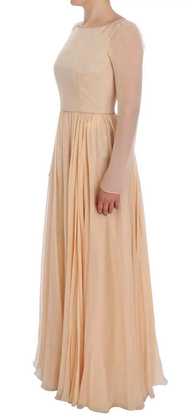 Robe longue beige en soie dolce & gabbana avec manches longues transparentes sans manches et jupe plissée