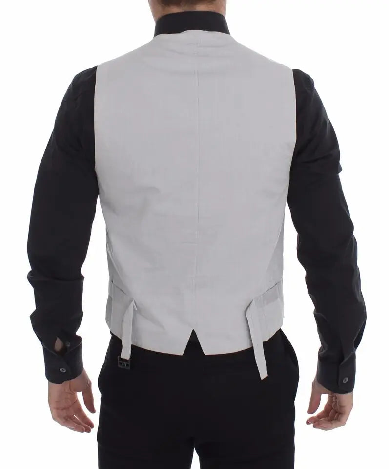 Dos d’un gilet formel beige dolce & gabbana en mélange de soie avec un design épuré et liens latéraux subtils