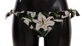 Bas de bikini dolce & gabbana noir avec imprimé lys blanc et feuilles vertes, détails à nouer sur les côtés