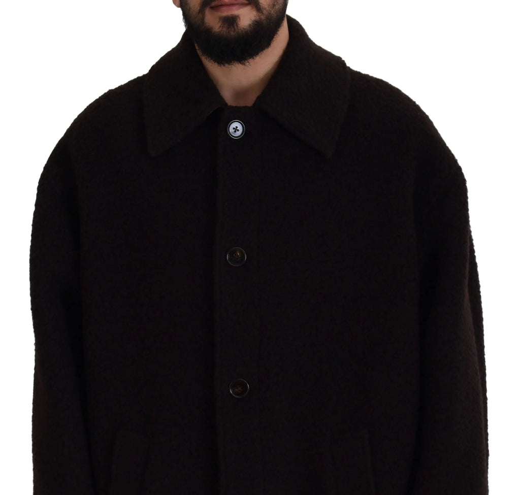 Manteau trench dolce & gabbana noir en alpaga avec col cranté et trois boutons sombres dont un orné d’emblème blanc