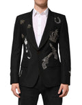 Dolce & gabbana blazer noir en laine avec embellissements argentés de chats, couronnes et pistolets