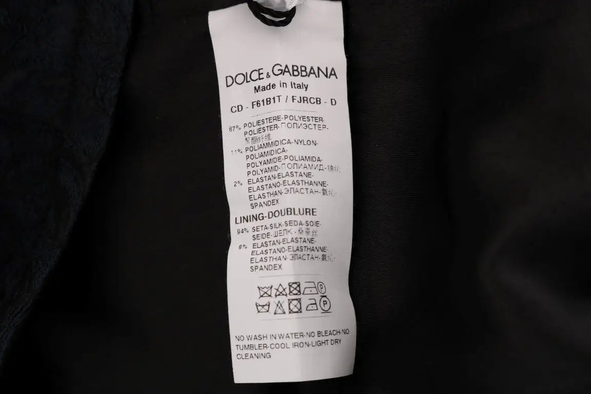 Étiquette de soin rectangulaire blanche avec texte noir dolce & gabbana sur robe mini flare noire et bleue