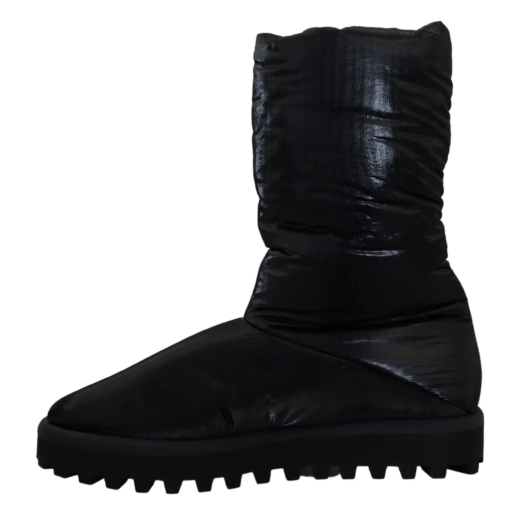 Bottes noires dolce gabbana rembourrées mi-mollet avec dessus matelassé brillant et semelle en caoutchouc épaisse