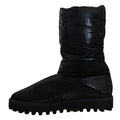 Bottes noires dolce gabbana rembourrées mi-mollet avec dessus matelassé brillant et semelle en caoutchouc épaisse