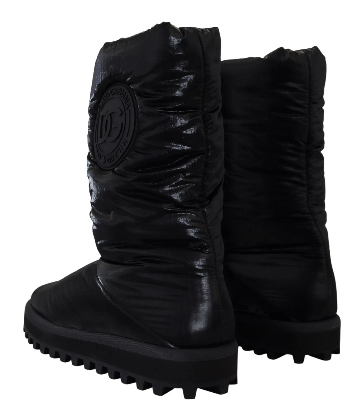 Bottes noires dolce & gabbana rembourrées mi-mollet en hiver avec finition brillante et logo circulaire sur le côté