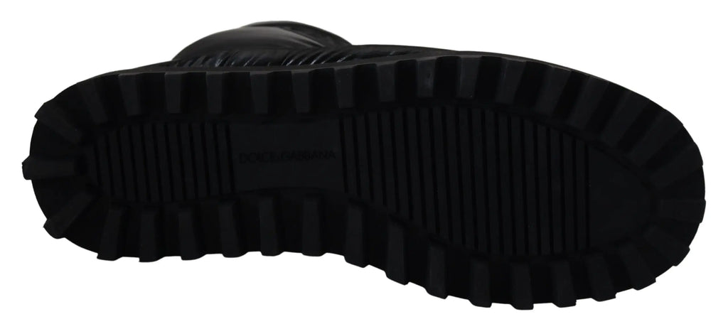 Semelle en caoutchouc noire avec motif de crampons profonds sur bottes mi-mollet rembourrées dolce & gabbana