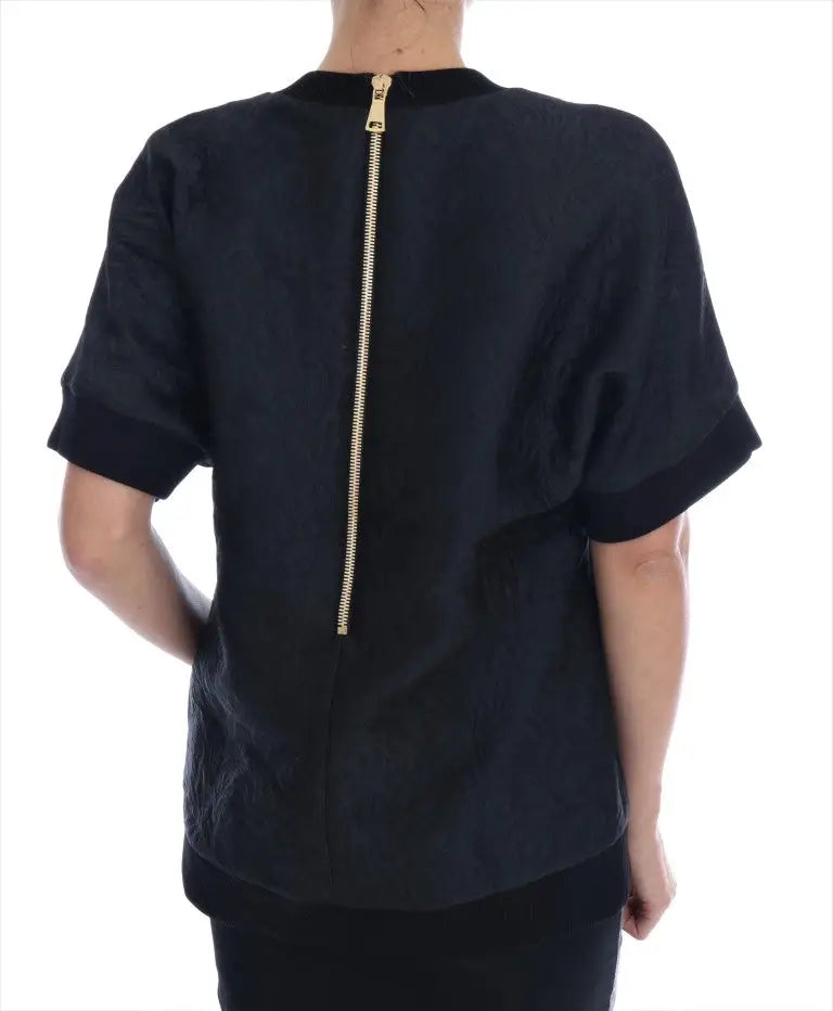 Dolce & Gabbana pull cocktail en brocart noir avec fermeture éclair dorée visible sur le dos