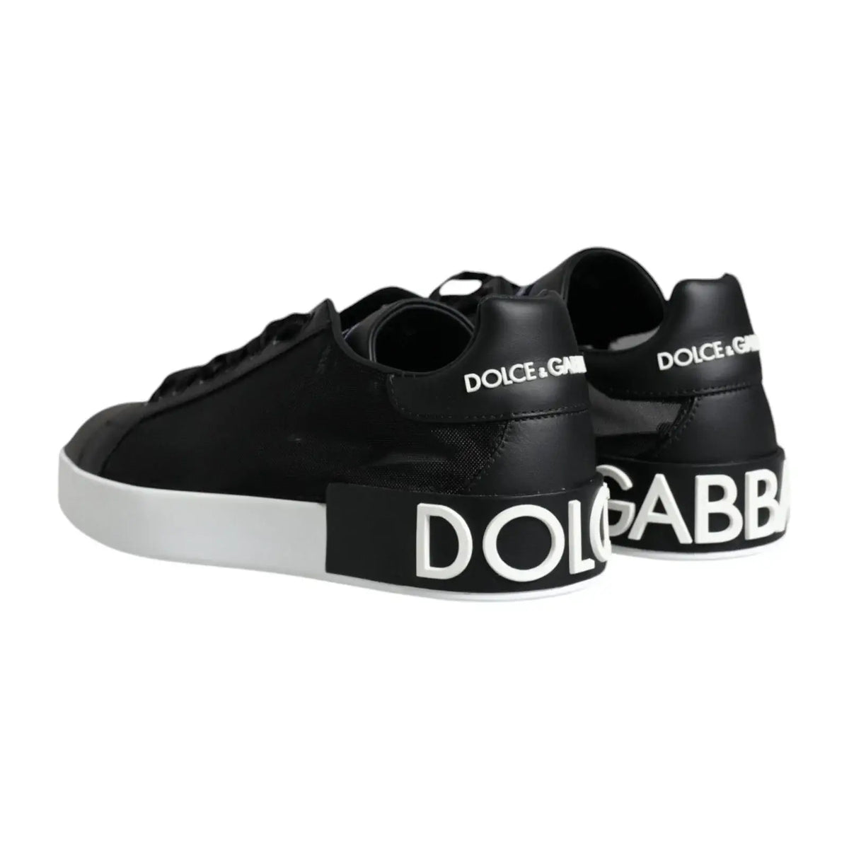 Vue arrière des baskets portofino dolce & gabbana noires en cuir de veau avec semelles blanches et lettrage blanc audacieux