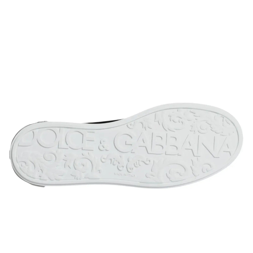 Semelle blanche en caoutchouc avec logo embossé dolce & gabbana et motifs décoratifs des baskets portofino en cuir noir