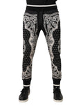 Dolce & gabbana joggers noirs en coton avec motifs paisley blancs et bordures contrastantes à la taille et aux chevilles