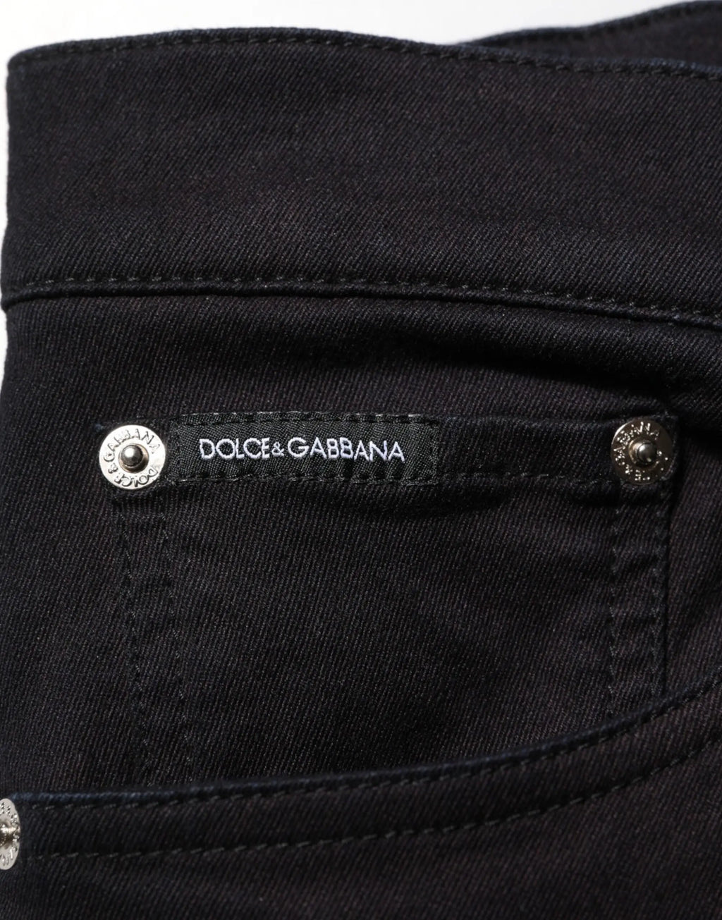 Jeans skinny noir dolce gabbana en coton mélangé avec étiquette de marque et boutons argentés visibles