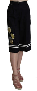 Pantalon capri noir plissé en coton dolce gabbana avec appliques sequins citron et olive dorés et bords blancs rayés