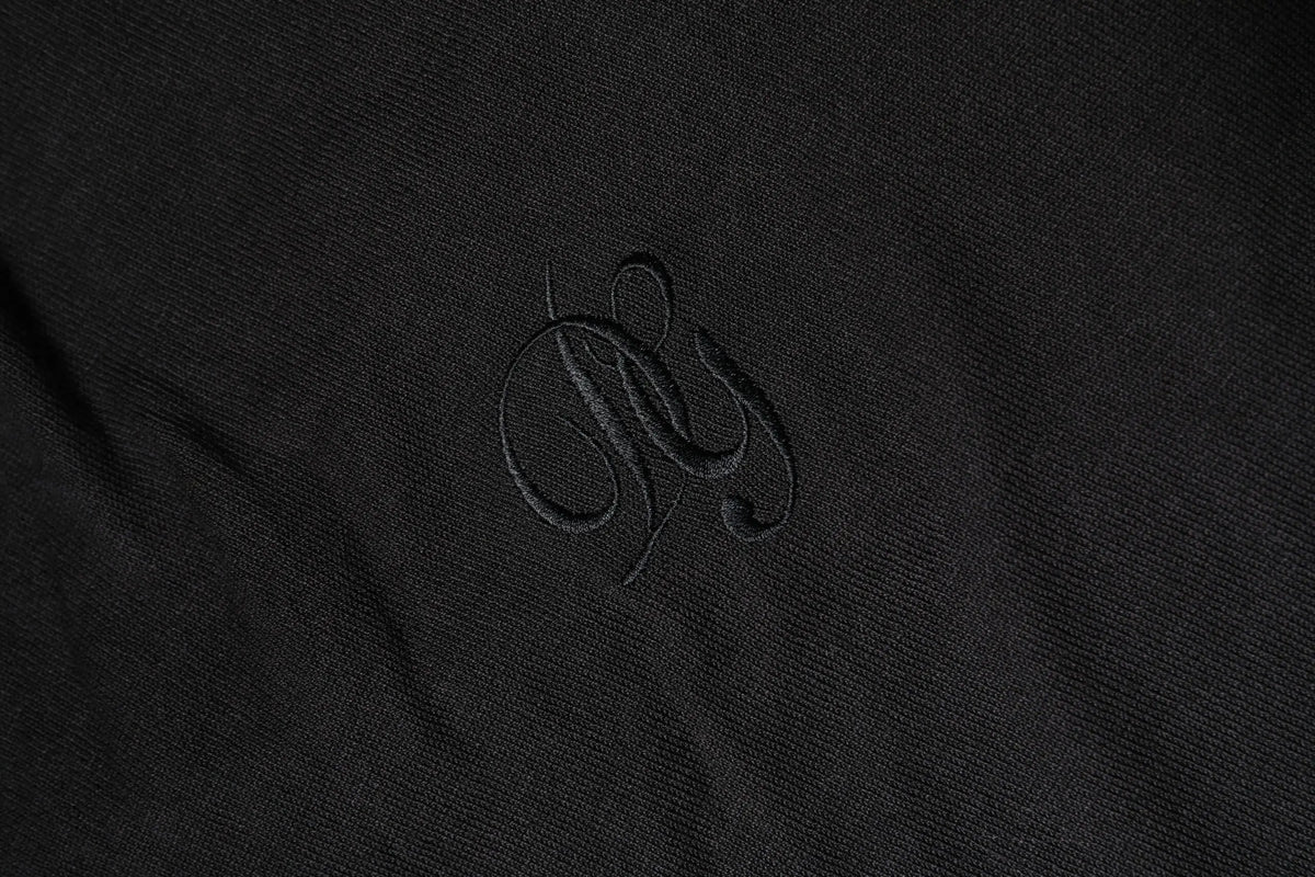 Logo brodé noir sur tissu noir texturé du sweatshirt en coton homme dolce & gabbana dg