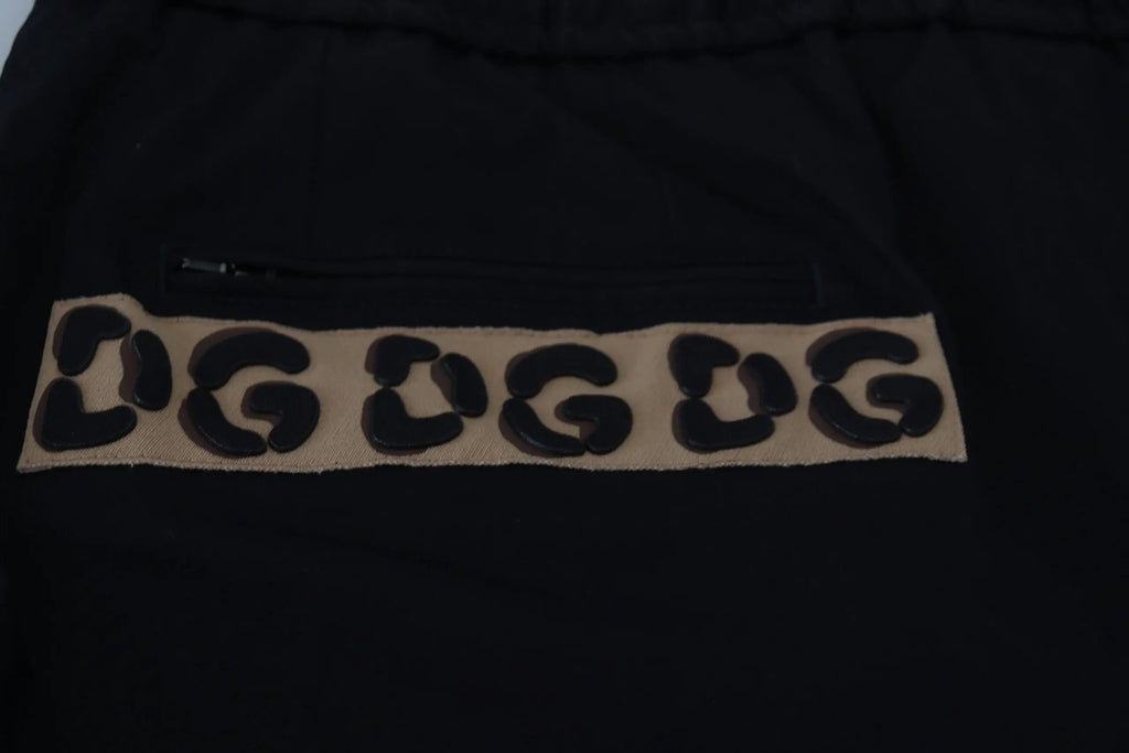 Dolce & gabbana black cotton cropped sweatpants with tan leopard print patch and bold black dug lettering on front