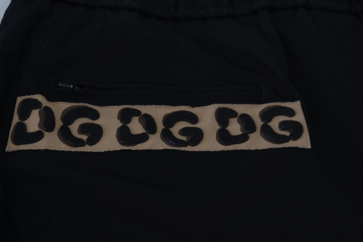 Dolce & gabbana black cotton cropped sweatpants with tan leopard print patch and bold black dug lettering on front
