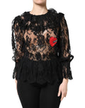Dolce & Gabbana blouse noire en coton avec dentelle florale, manches volantées, bas peplum et patch cœur rouge